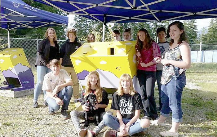 Some members of the Rotary Interact Club of Golden pose with the garbage cans that they painted