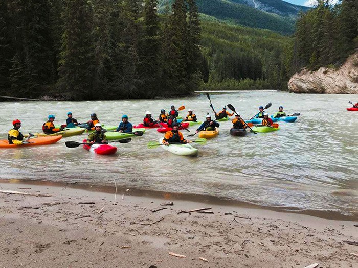 A group of paddlers gathered on the Kicking Horse River during last year’s inaugural Kicking Horse Paddle Festival.