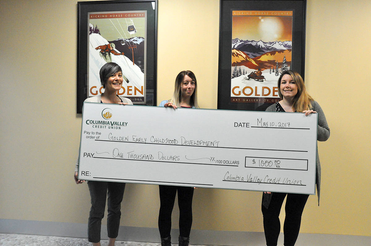The Columbia Valley Credit Union donated $1,000 to the Golden Community Resources Society, represented by ShellyWadden (centre) to go towards the Kinsman Park project. Jessica Schwitek/Star Photo