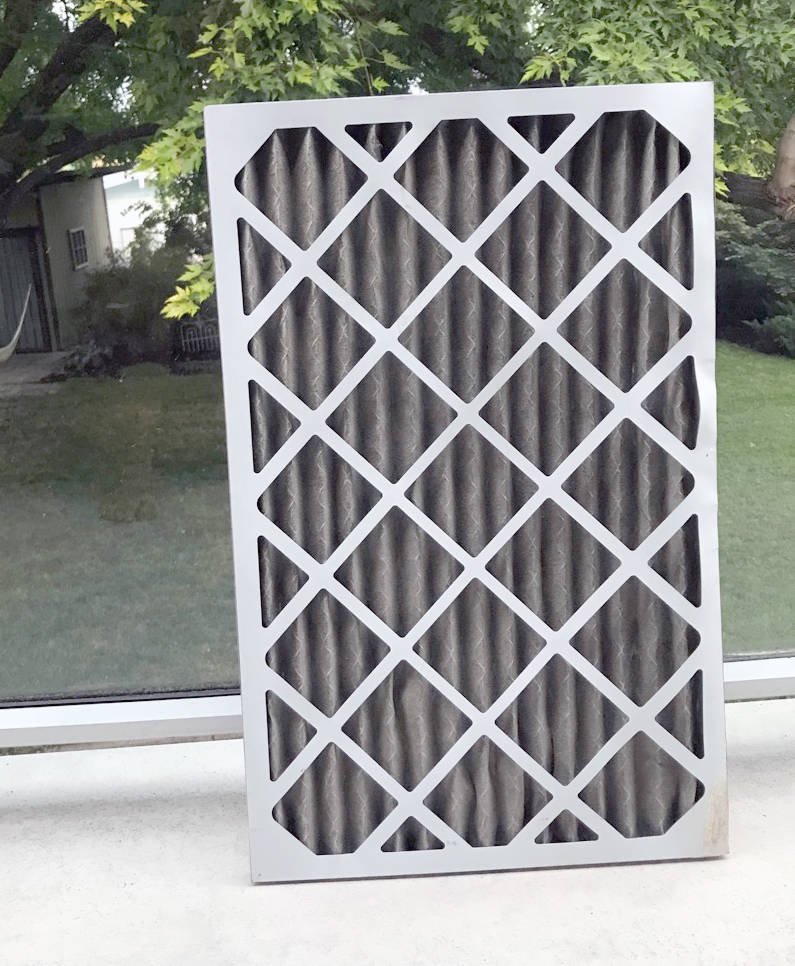This is a furnace filter from a home in the Okanagan which was brand new — white and clean — just three weeks prior. (Photo contributed)