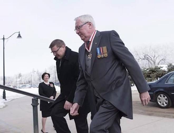 Thomas Molloy walks up the steps to the Legislative Building in Regina, Saskatchewan on Wednesday March 21, 2018. THE CANADIAN PRESS/Michael Bell