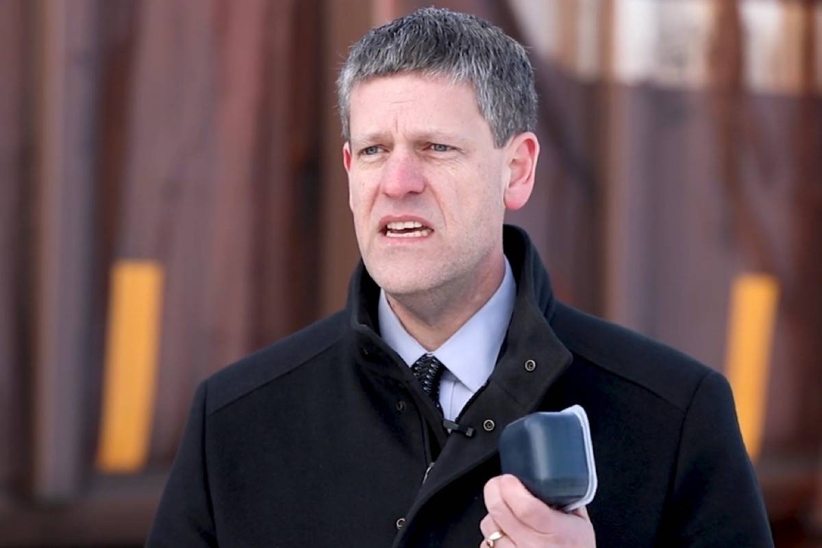 James Auld, CN senior manager of product development, holds a “Canapux” filled with solidified bitumen. (CN Rail)