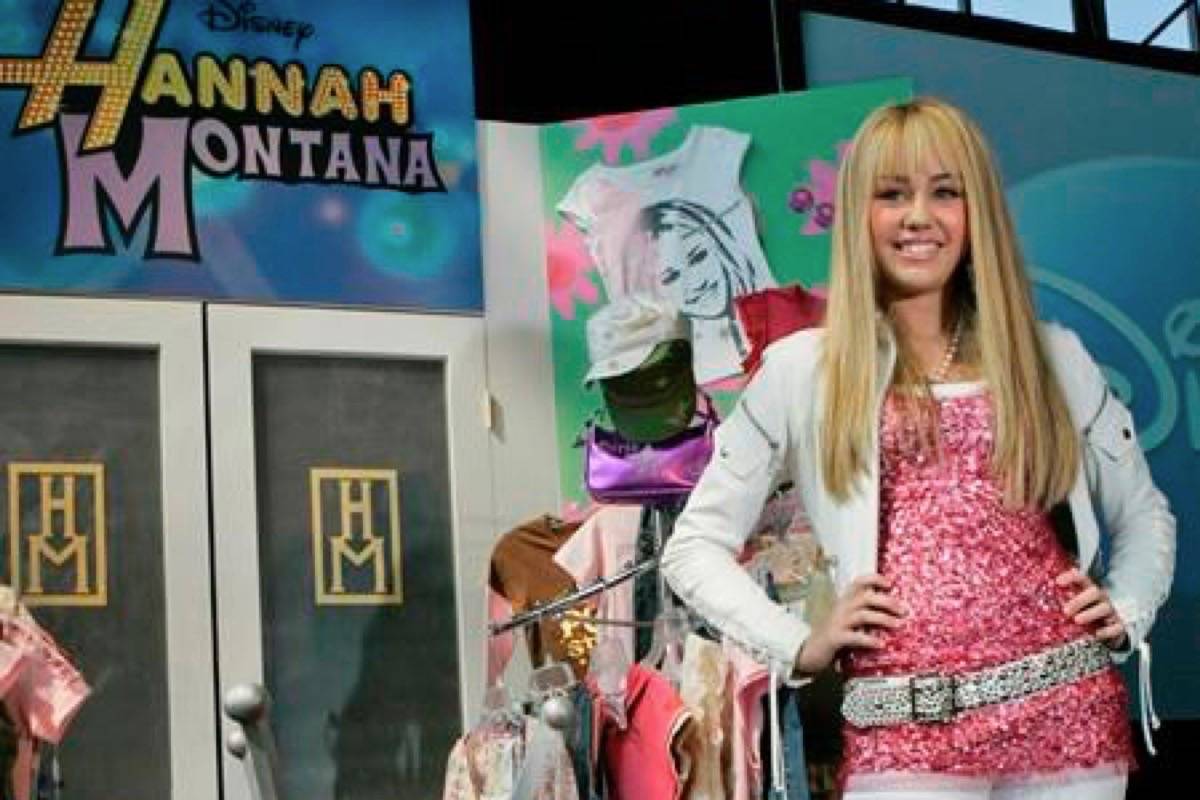 FILE - In this June 19, 2007 file photo Miley Cyrus, star of The Disney Channel’s series “Hannah Montana” makes an appearance at the Licensing International Expo in New York. Costumes, props and tour items from the Disney Channel‚Äôs ‚ÄúHannah Montana‚Äù TV series are going up for auction. The teen sitcom featured Cyrus, who portrayed schoolgirl Miley Stewart by day and international pop star Hannah Montana by night. It helped launched Cyrus‚Äô career and the franchise included albums, films and concerts. Julien‚Äôs Auctions announced on Thursday, April 11, 2019, all proceeds will benefit the Wilder Minds charity, which aids the world‚Äôs at-risk animals. (AP Photo/Mary Altaffer, File)