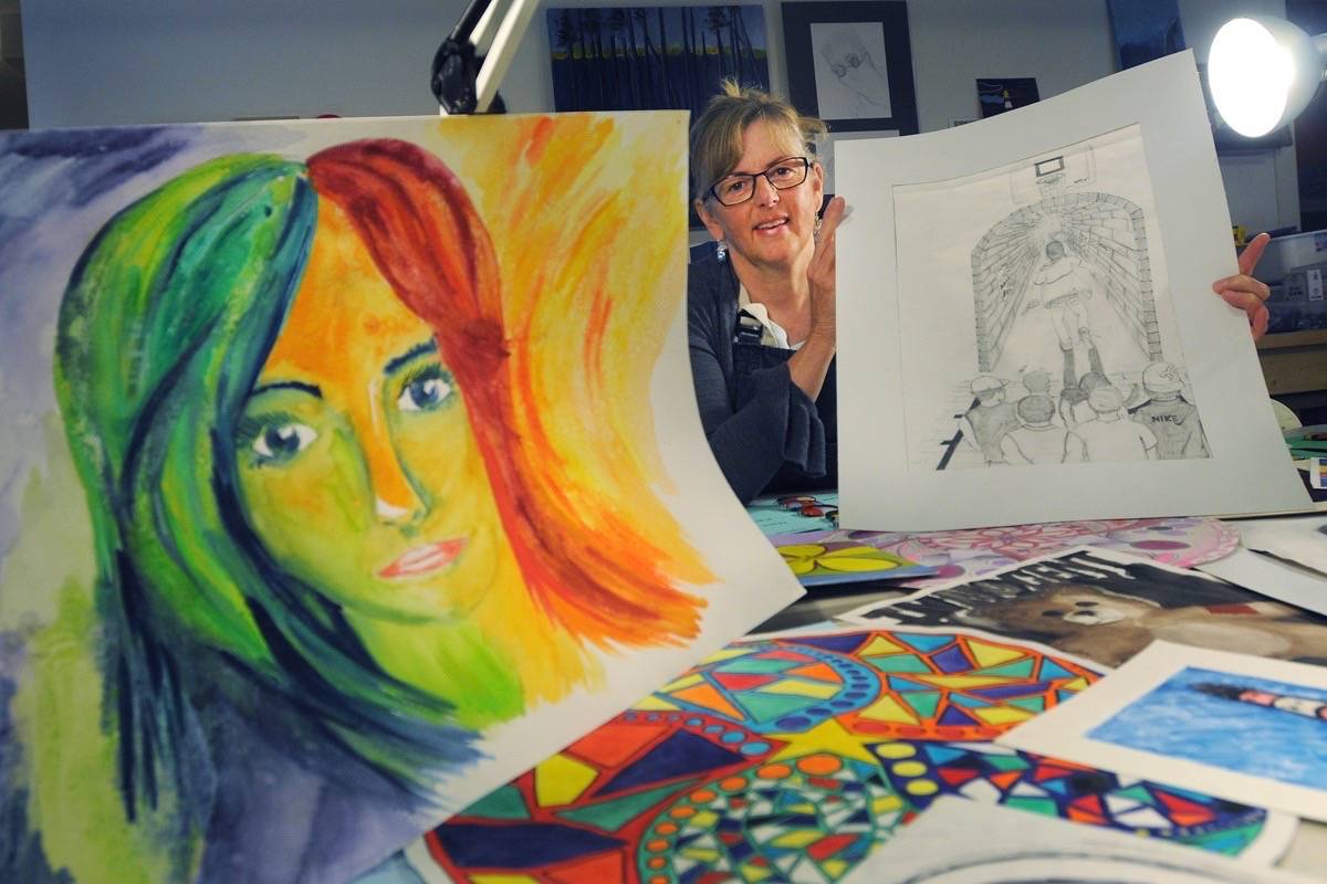 (Colleen Flanagan/THE NEWS)                                Philippa Glossop with some of the artwork that was created by students with anxiety.