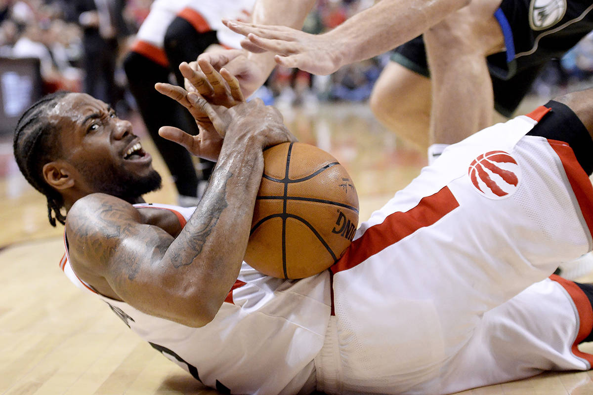 Toronto Raptors forward Kawhi Leonard (2) keeps hold of the ball after being fouled during second half NBA Eastern Conference finals action against the Milwaukee Bucks, in Toronto on Saturday, May 25, 2019. THE CANADIAN PRESS/Nathan Denette