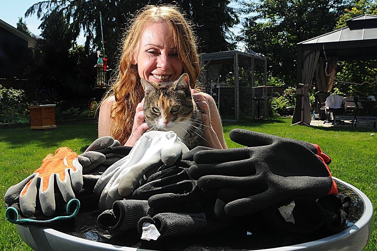 Karen Nixon with her thieving kitty, Cricket. (Colleen Flanagan/THE NEWS)