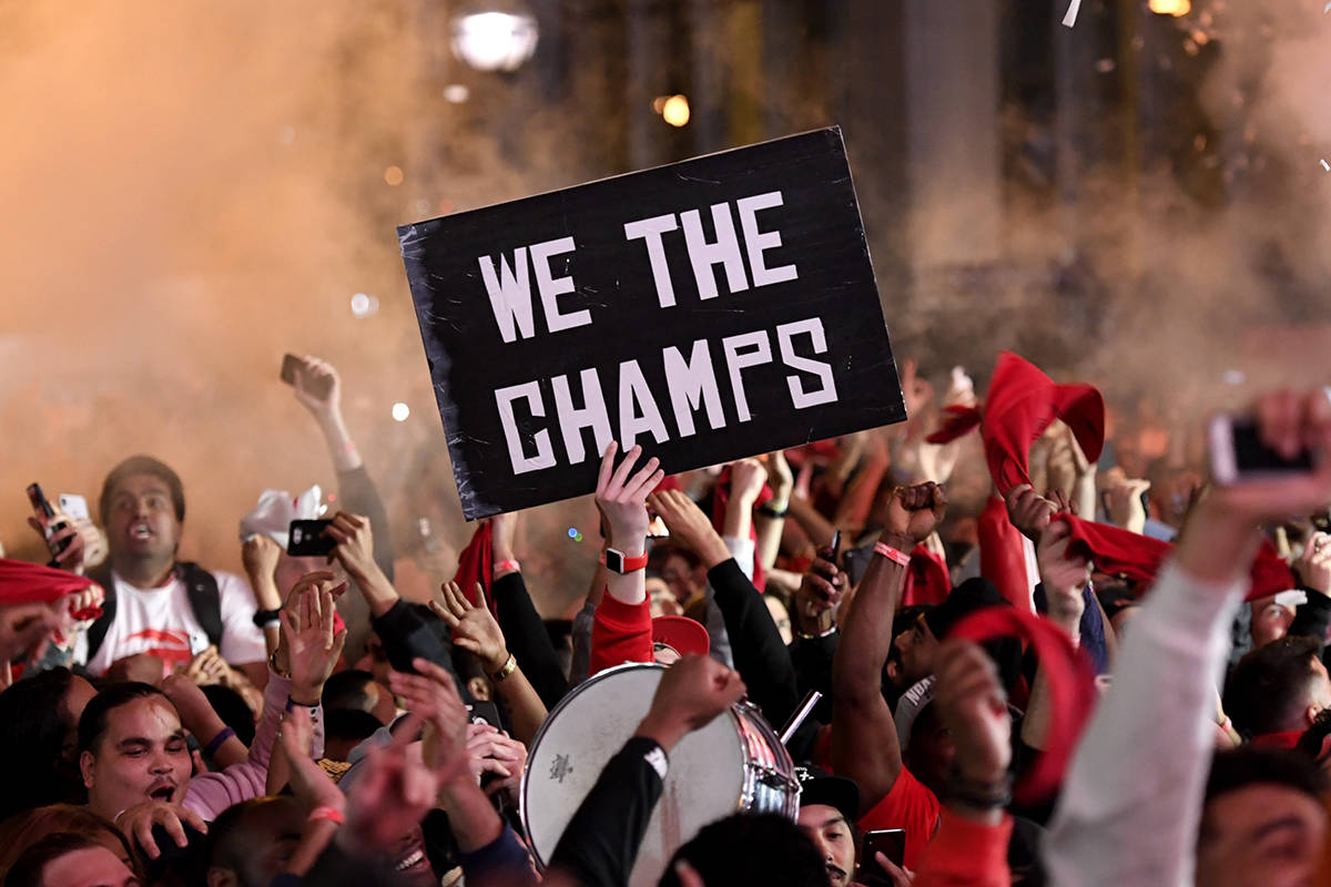 Toronto Raptors fans react inside Jurassic Park, outside of the Scotiabank Arena, in Toronto, as they watch the Raptors defeat the Golden State Warriors in game 6 of the NBA Finals to win the NBA Championship, Thursday, June 13, 2019. THE CANADIAN PRESS/Nathan Denette