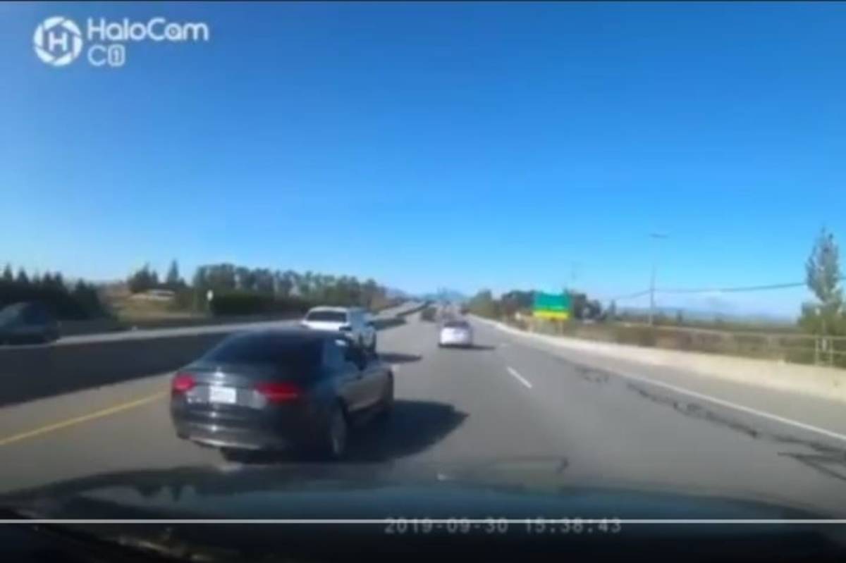 A video shared by the Delta Police Department shows a car on Highway 17 weaving in and out of traffic at a high rate of speed, narrowly missing a police officer stopped on the side of the road. (Delta Police Department photo)