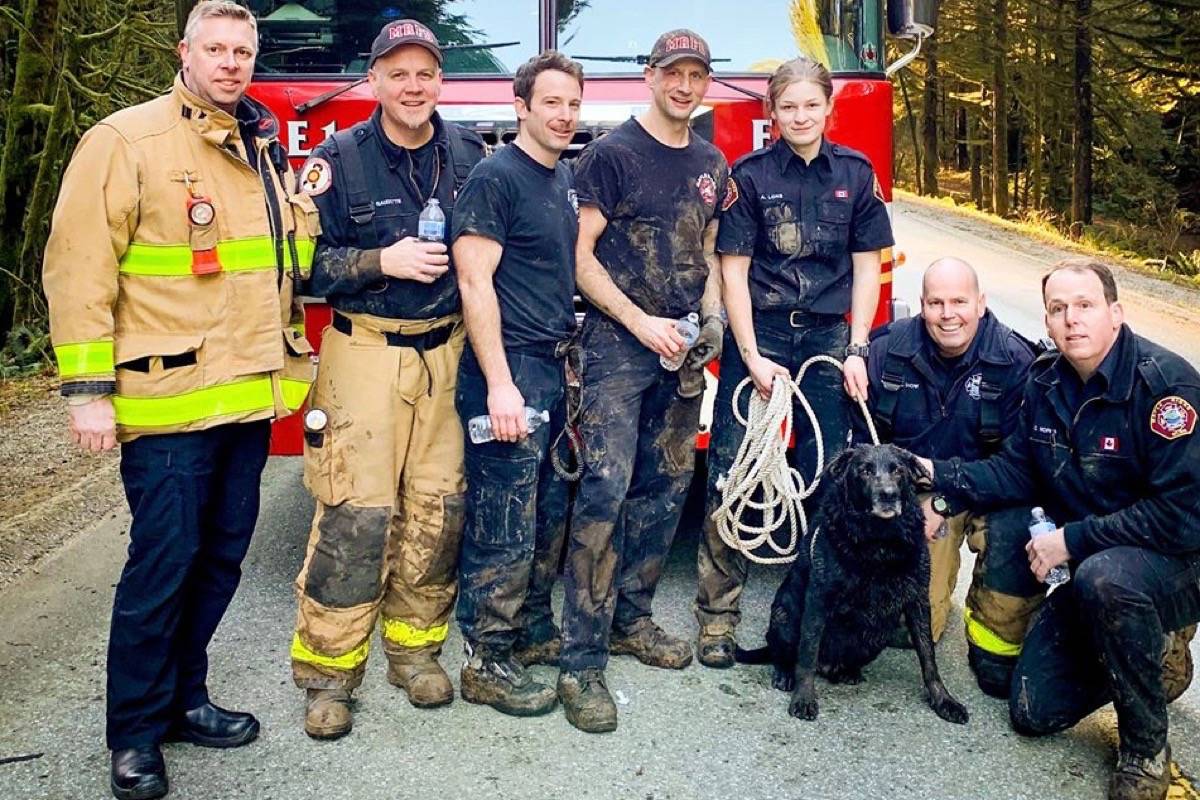 Maple Ridge firefighters pose with Corrado around 10 minutes after he was rescued. (Contributed)