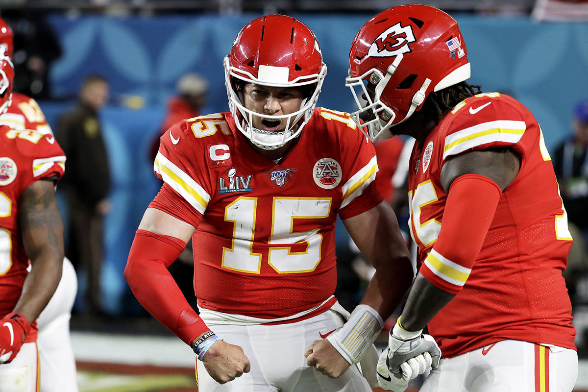 Kansas City Chiefs quarterback Patrick Mahomes (15) celebrates after scoring against the San Francisco 49ers during the first half of the NFL Super Bowl 54 football game Sunday, Feb. 2, 2020, in Miami Gardens, Fla. (AP Photo/Seth Wenig)