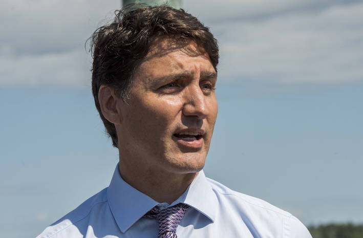 Prime Minister Justin Trudeau speaks next to the Watermark sculpture along the St. John River in Fredericton, New Brunswick on Thursday August 15, 2019. (Stephen MacGillivray/The Canadian Press)