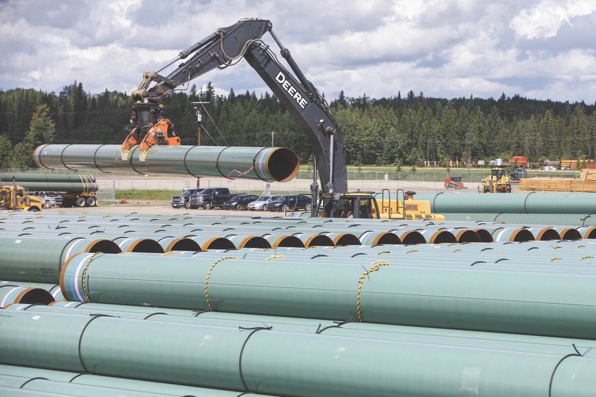 Pipe for the Trans Mountain pipeline unloaded in Edson on June 18, 2019. (File photo by THE CANADIAN PRESS)
