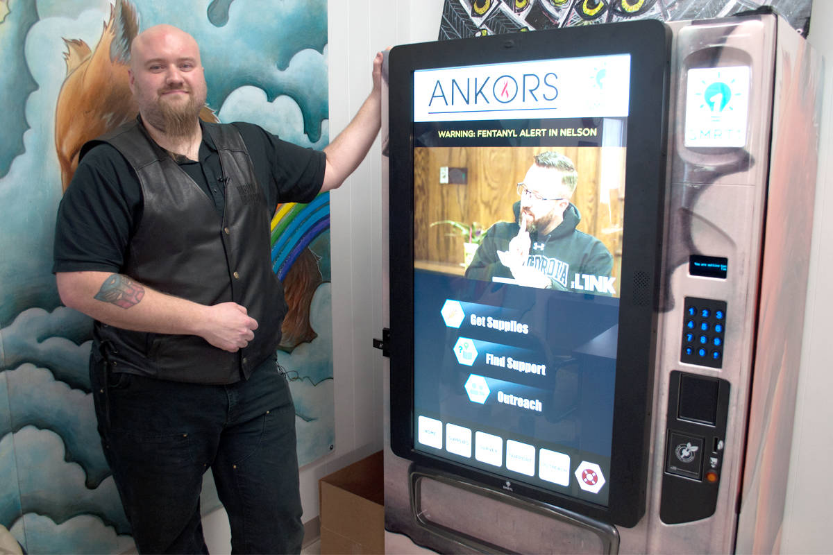Brad Pommen, president of SMRT1 Technologies, shows off a new vending machine at ANKORS in Nelson that carries items such as naloxone and syringes. Photo: Tyler Harper