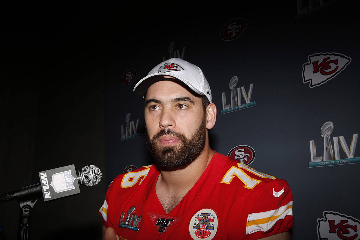 In this Wednesday, Jan. 29, 2020 photo, Kansas City Chiefs offensive guard Laurent Duvernay-Tardif (76) speaks during a news conference in Aventura, Fla., for the NFL Super Bowl 54 football game. A Quebec-born Super Bowl champion is making the move from the offensive line to the medical front line. THE CANADIAN PRESS/AP, Brynn Anderson