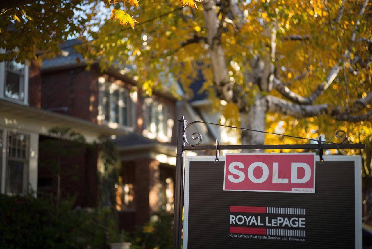 A real estate sold sign hangs in front of a west-end Toronto property Friday, Nov. 4, 2016. THE CANADIAN PRESS/Graeme Roy