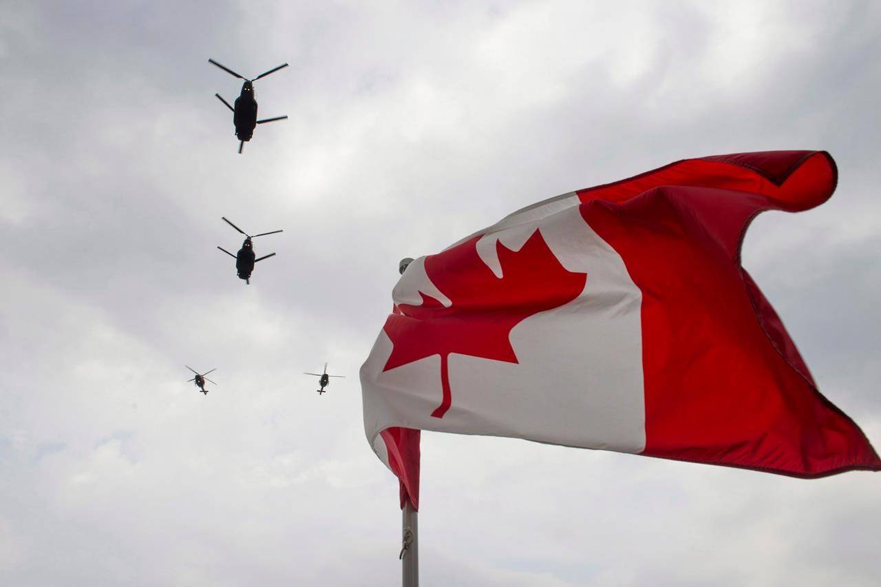Canadian Forces CH-47 Chinook helicopters participate in a flyover of Parliament Hill in Ottawa on Friday, May 9, 2014. The Canadian Armed Forces is postponing the deployment of a warship and surveillance aircraft to help enforce United Nations’ sanctions against North Korea because of the COVID-19 pandemic. THE CANADIAN PRESS/Justin Tang