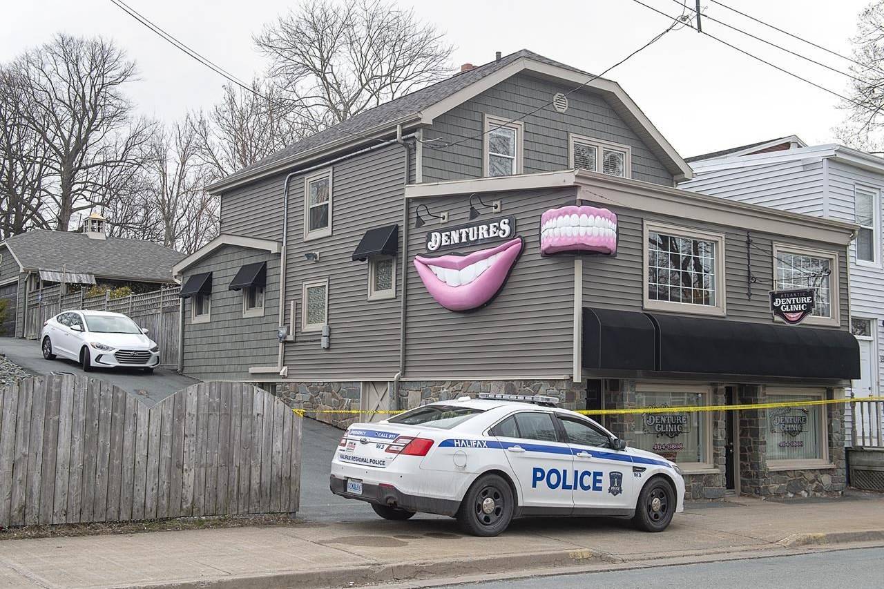 The Atlantic Denture Clinic is guarded by police in Dartmouth, N.S. on Monday, April 20, 2020. The repeated threats and isolation a Nova Scotia mass shooter allegedly used against his spouse show why such cruelty should be a criminal offence in Canada, experts on domestic violence say. Acquaintances and former neighbours have described the 51-year-old killer as a clever and manipulative millionaire who would threaten harm to his spouse’s family, control her money or cut off her means of escape by removing the tires from her car or blocking the driveway. THE CANADIAN PRESS/Andrew Vaughan