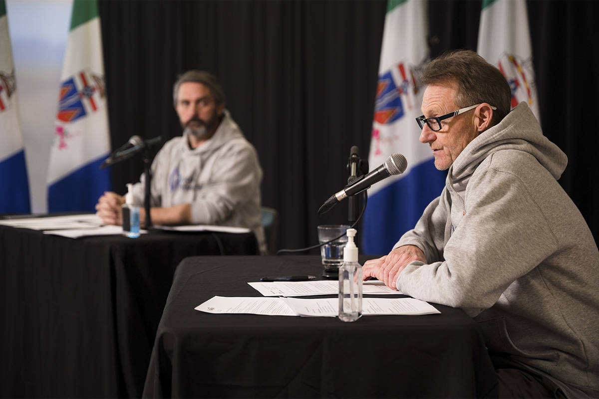Premier Sandy Silver, left, and Chief Medical Officer of Health Dr. Brendan Hanley speak during a COVID-19 press conference in Whitehorse on May 22. (Alistair Maitland Photography)