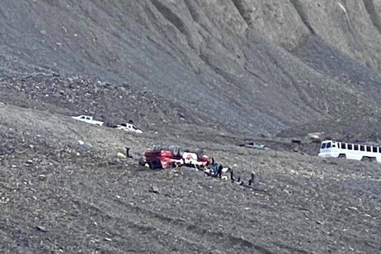RCMP in Alberta say there are reports that multiple people are injured after a bus, similar to the vehicle pictured, rolled over on a highway that runs between Jasper and Banff National Parks. Responders attend to a rolled-over icefield touring bus in Jasper National Park, Alta., in a handout photo taken Saturday, July 18, 2020. THE CANADIAN PRESS/HO-Randy Cusack