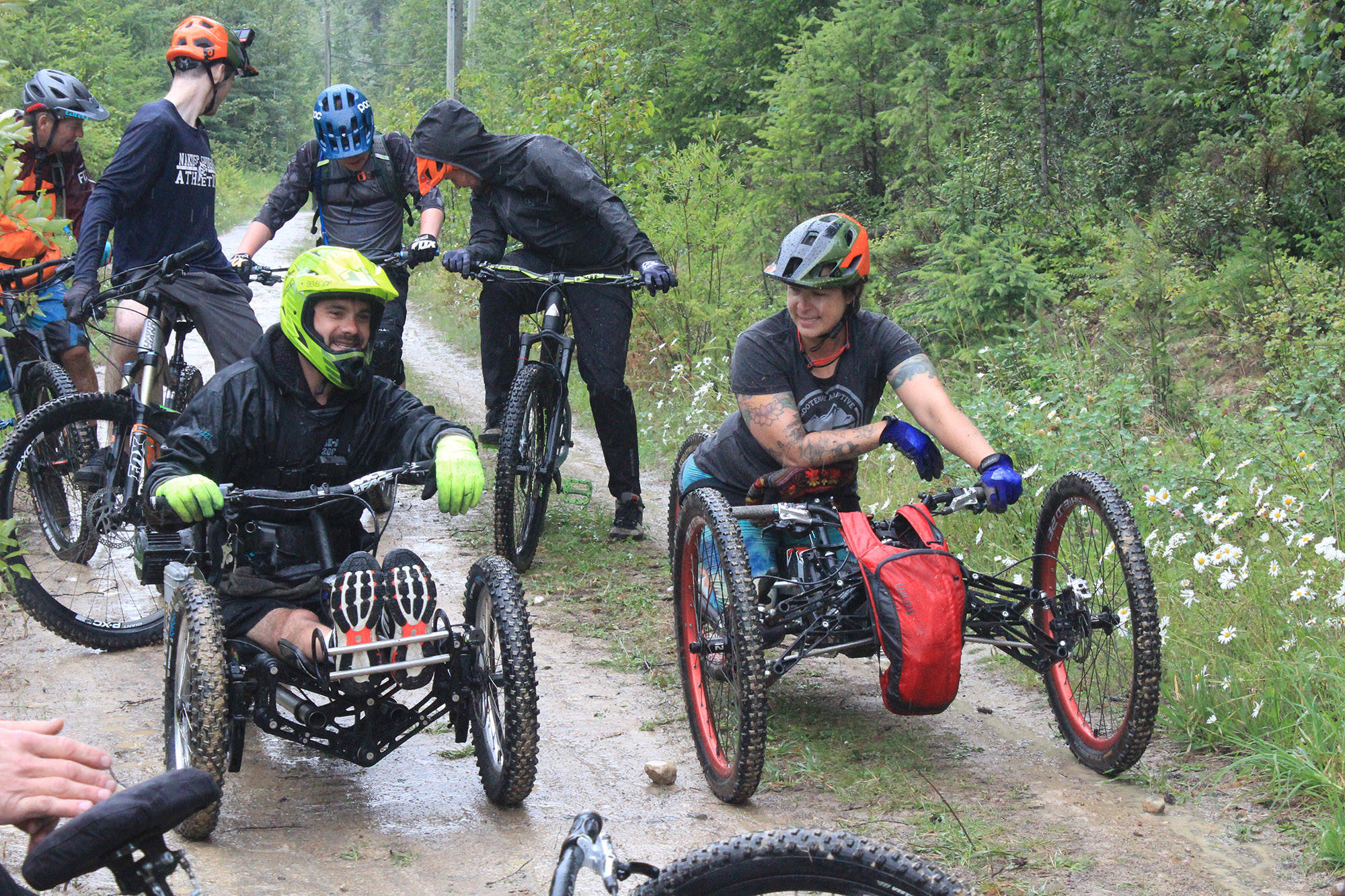 A couple of the adaptive bikes and riders that were able to take the inaugural lap in the rain on Friday. (Claire Palmer photo)