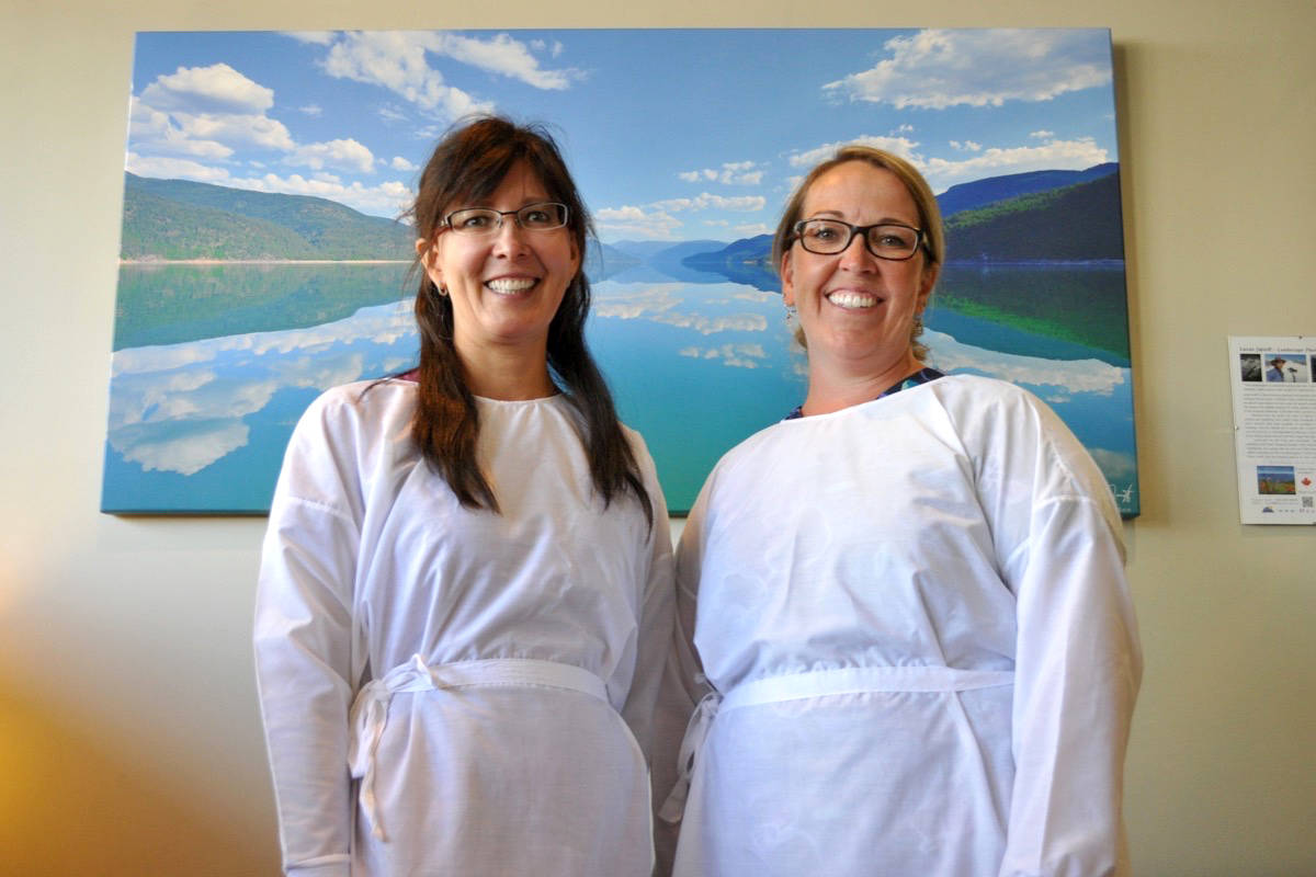 Dr. Karen Lee (left) and certified dental assistant Lana Healey model the surgical gowns made by burlesque star Judith Stein for Dr. Matthew Osepchook’s office. Photo: Tyler Harper