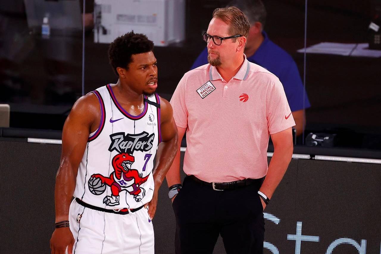 Toronto Raptors head coach Nick Nurse, right, talks with Kyle Lowry (7) during the first quarter of an NBA basketball game against the Memphis Grizzlies, Sunday, Aug. 9, 2020, in Lake Buena Vista, Fla. Toronto Raptors coach Nick Nurse says the idea of a boycott “is on the table” after players from his team and the Boston Celtics met Tuesday night in advance of their NBA playoff series. THE CANADIAN PRESS/AP, Kevin C. Cox/Pool Photo
