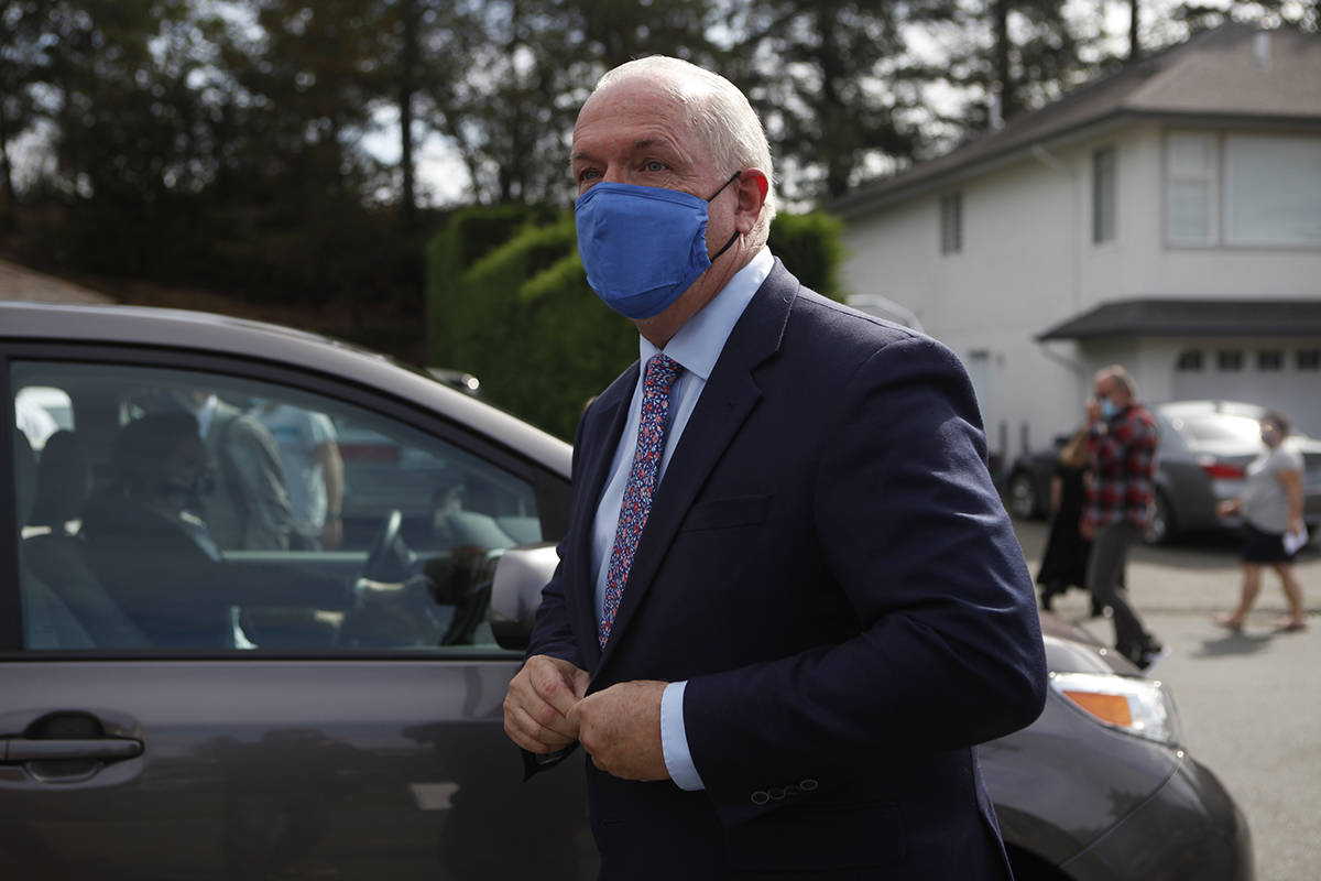 Premier John Horgan heads to his ride following his announcement that there will be a fall election as he speaks during a press conference in Langford, B.C., on Monday September 21, 2020. THE CANADIAN PRESS/Chad Hipolito