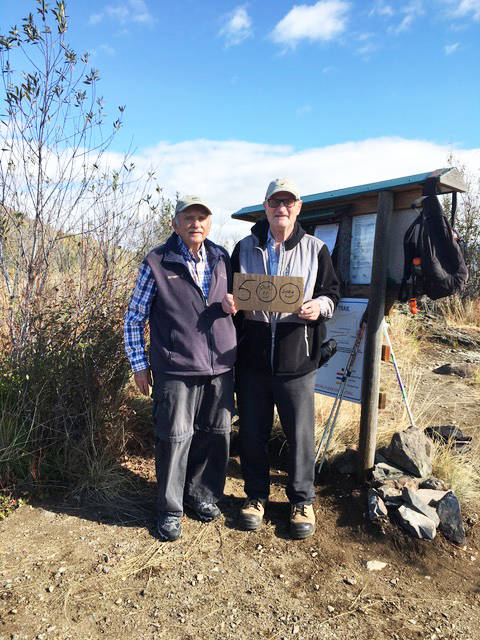 Three years ago, Larry Plummer challenged himself to hike up to the flag viewpoint on the Montrose Antenna trail 1,000 times. He invited Art Benzer (left) and Gordon McAlpine (photographer) to accompany him on his 500th summit on Oct 11, 2020. Photo: Gordon McAlpine
