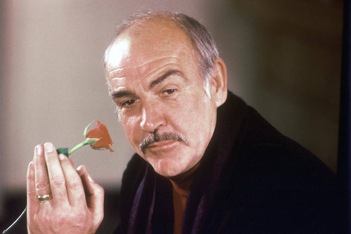 FILE - In this Jan. 23, 1987 file photo, actor Sean Connery holds a rose in his hand as he talks about his new movie “The Name of the Rose” at a news conference in London. Scottish actor Sean Connery, considered by many to have been the best James Bond, has died aged 90, according to an announcement from his family. (AP Photo/Gerald Penny, File)