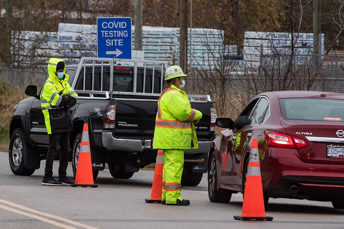 Motorists wait to enter a Fraser Health COVID-19 testing facility, in Surrey, B.C., on Monday, November 9, 2020. THE CANADIAN PRESS/Darryl Dyck