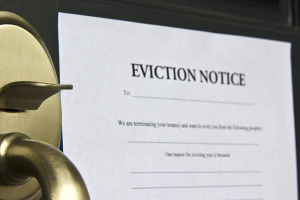 Eviction notice letter pasted on front door of a house (B.C. Tenants photo)