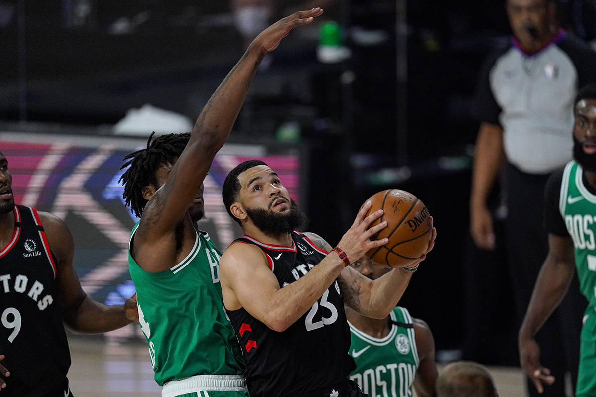 Toronto Raptors guard Fred VanVleet (23) shoots in front of Boston Celtics center Robert Williams III (44) during the first half of an NBA conference semifinal playoff basketball game Wednesday, Sept. 9, 2020, in Lake Buena Vista, Fla. (AP Photo/Mark J. Terrill)