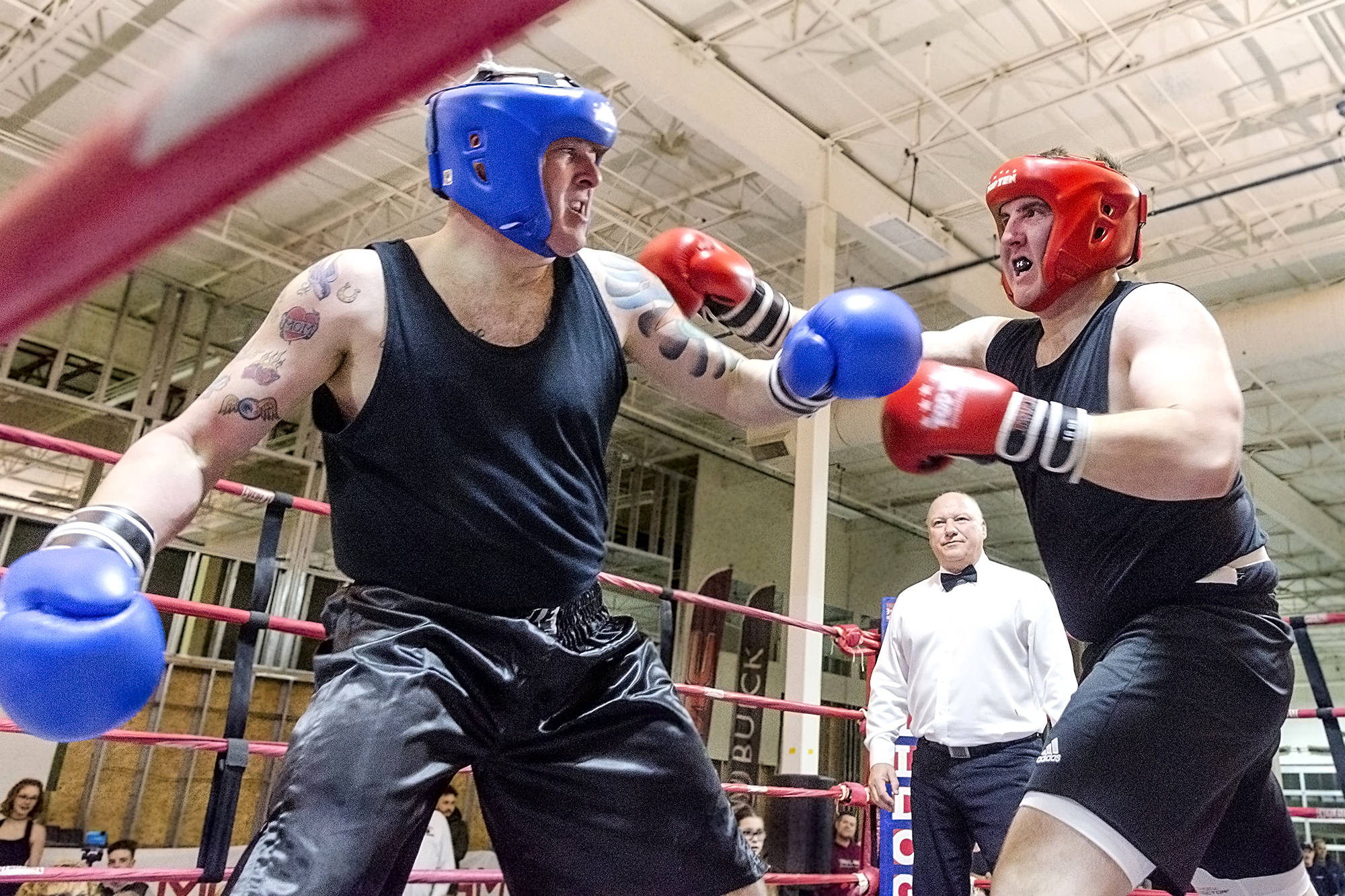 The Salmon Arm Observer’s Jim Elliot dukes it out with Wade Stewart during the inaugural Hit2Fit charity boxing event at Westgate Public Market in 2017. (File photo)