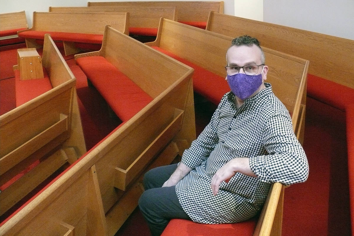 Rev. Andrew Halladay, the vicar at St. Andrew’s Anglican Church in Langley, sits in an empty pew on Tuesday, Jan. 5. His church had to move online because of COVID-19 limits on public gatherings. Halladay is one of 38 church leaders in B.C. to sign a joint letter of support for provincial health officer Dr. Bonnie Henry. (Dan Ferguson/Langley Advance Times)