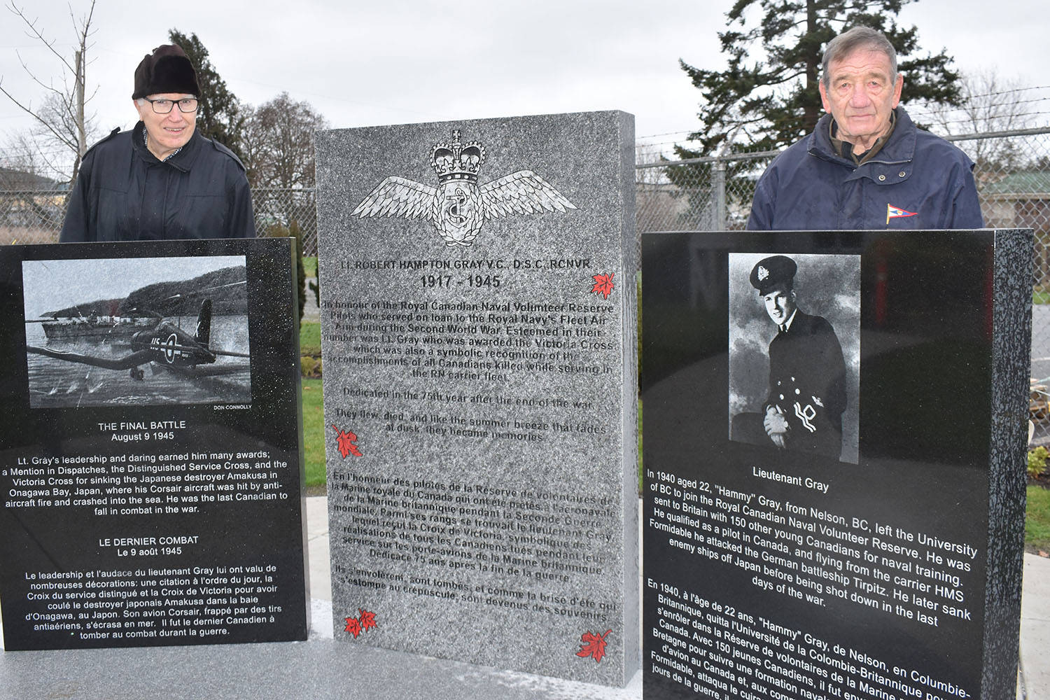 Gerald Pash and Terry Milne flank the central pillar of the monument recognizing Lieut. Robert Hampton Gray now standing outside the North Saanich’s BC Aviation Museum following its installation Tuesday. The two men were among those who fundraised $100,000 for the monument. (Wolf Depner/News Staff)