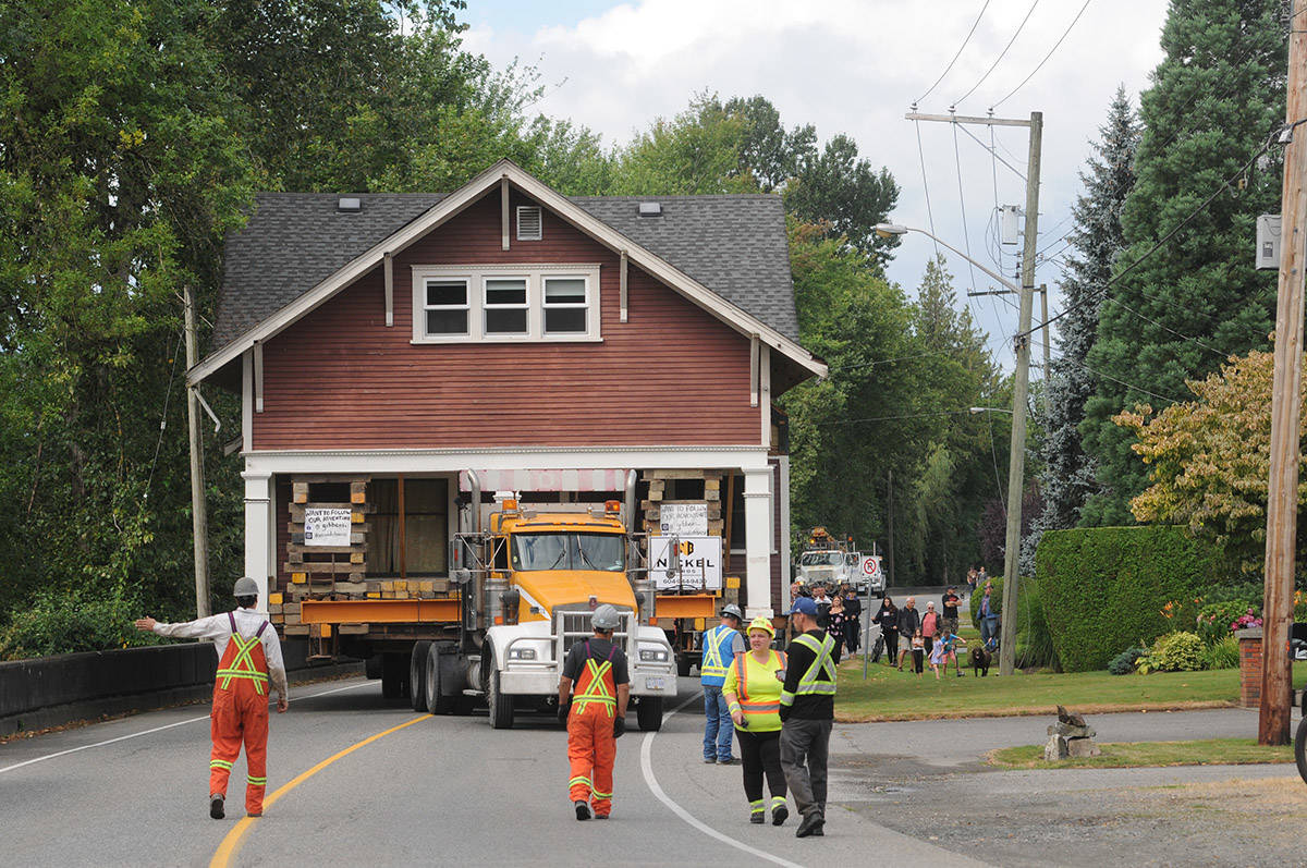 Crews move a 110-year-old heritage house along a road in Chilliwack on Aug. 7, 2020 to relocate it. Monday, Jan. 11 is Heritage Treasures Day. (Jenna Hauck/ Chilliwack Progress file)