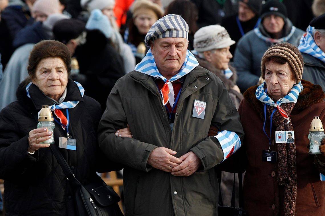 File - In this Sunday, Jan. 27, 2019 file photo, survivors of the Nazi death camp Auschwitz arrive for a commemoration ceremony on International Holocaust Remembrance Day at the International Monument to the Victims of Fascism inside Auschwitz-Birkenau in Oswiecim, Poland. Hundreds of Holocaust survivors in Austria and Slovakia are getting vaccinated against the coronavirus exactly 76 years after the liberation of the Nazi’s Auschwitz death camp. More than 400 Austrian survivors were invited to get the vaccine at Vienna’s biggest mass vaccination center on International Holocaust Remembrance Day on Wednesday Jan. 27, 2021. (AP Photo/Czarek Sokolowski)