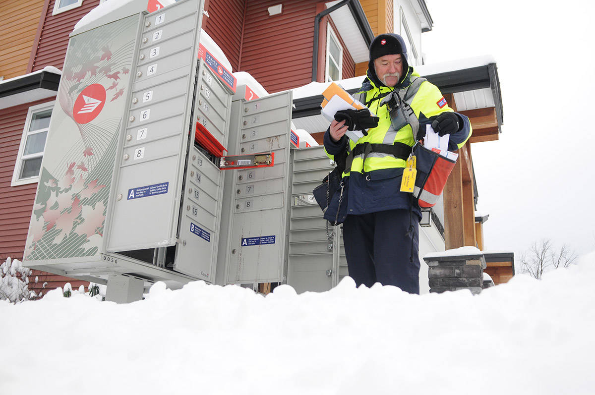 Canada Post carrier, Gary Savard, delivers mail in the snow in Chilliwack on Jan. 13, 2020. Thursday, Feb. 4, 2021 is Thank A Mail Carrier Day. (Jenna Hauck/ Chilliwack Progress file)