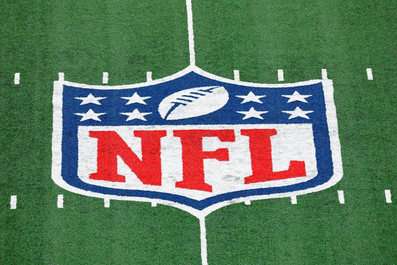 The NFL logo is displayed at midfield during an NFL football game between the Tampa Bay Buccaneers and the New York Giants in East Rutherford, N.J. (AP Photo/Adam Hunger, FIle)