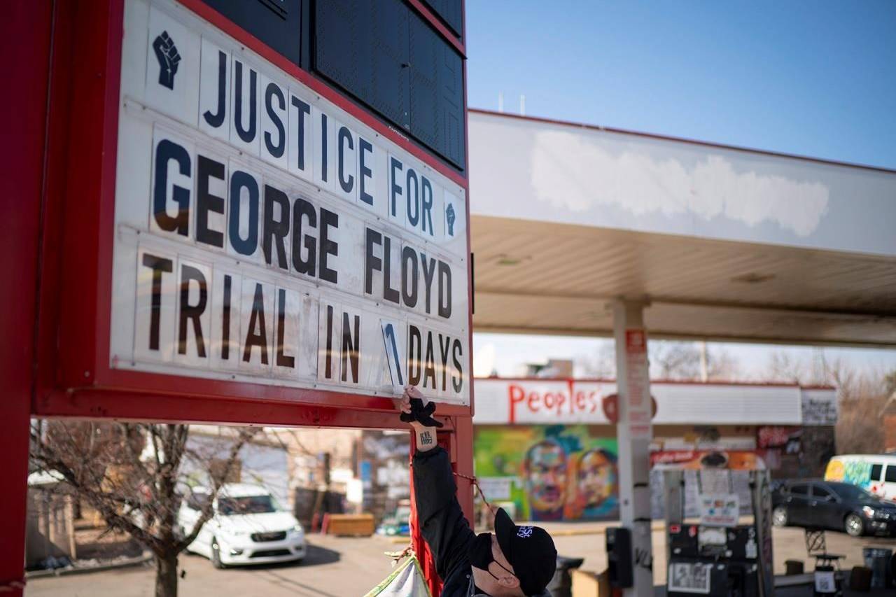 Billy Briggs, who lives just 170 steps from where George Floyd was killed, created and maintains the countdown sign at the gas station on the corner of George Floyd Square in Minneapolis, Minn. On Sunday, the eve of the trial date, he updated it to “1”. (Jeff Wheeler /Star Tribune via AP)