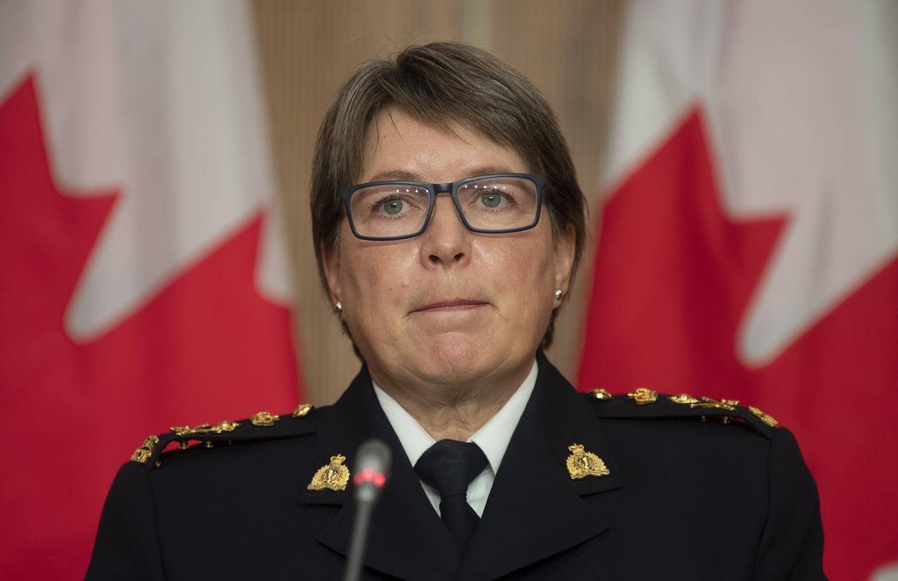 RCMP Commissioner Brenda Lucki listens to a question during a news conference in Ottawa on October 21, 2020. THE CANADIAN PRESS/Adrian Wyld