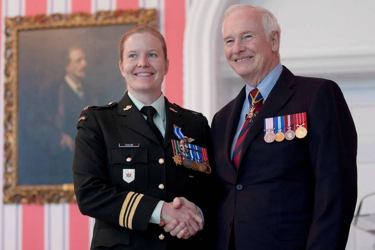 Governor General David Johnston presents then Major Eleanor Taylor, from Antigonish, N.S., with the Meritorious Service Medal during a ceremony in Ottawa, Ont. Friday June 22, 2012. A female officer of the Canadian Armed Forces is quitting the military, saying she is “sickened” by ongoing investigations of sexual misconduct against senior military leaders. THE CANADIAN PRESS/Adrian Wyld