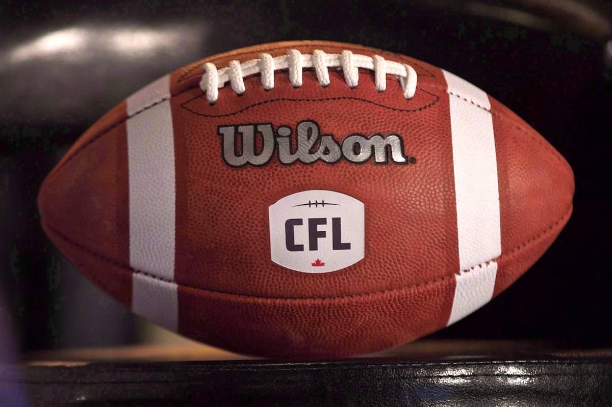 A football with the CFL logo sits on a chair during a press conference in Winnipeg, Friday, November 27, 2015. The CFL denied a social media claim from the United Football Players Association suggesting the league will likely cancel its 2021 and ‘22 seasons. THE CANADIAN PRESS/John Woods