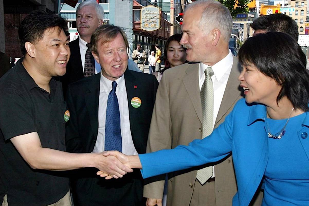 Former MP Ian Waddell (second from left) accompanies then-federal NDP Leader Jack Layton (second from right) during a campaign stop in Vancouver in May 2004. (The Canadian Press)