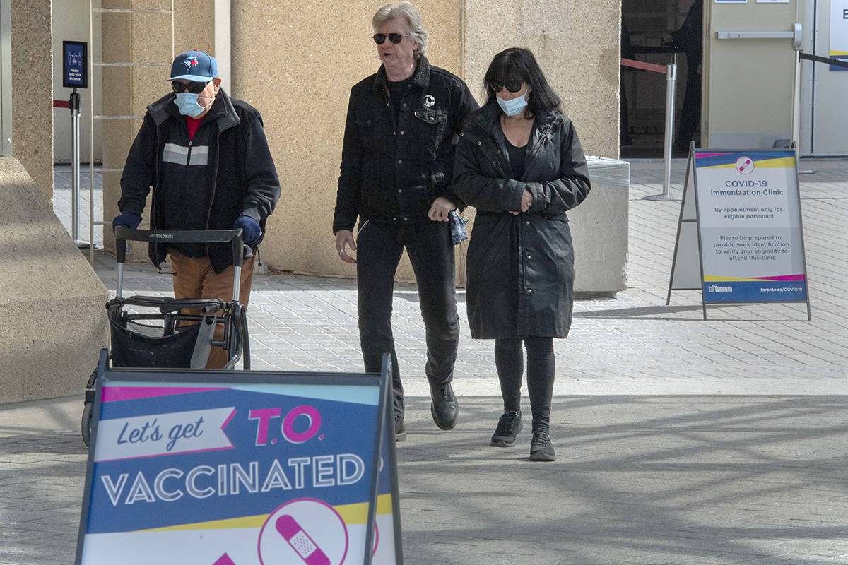 Visitors leave from a mass vaccination clinic in Toronto on Wednesday, March 17, 2021. THE CANADIAN PRESS/Frank Gunn