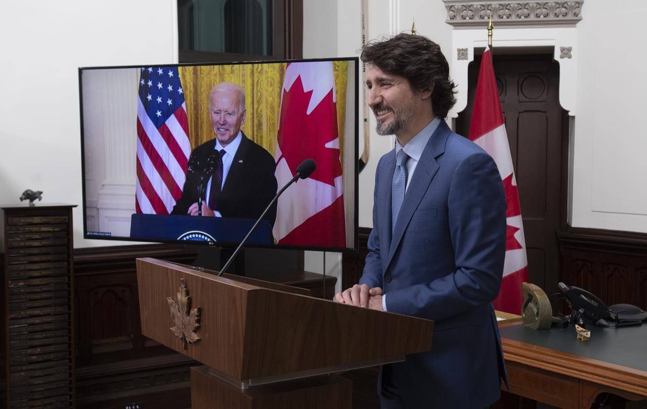Canadian Prime Minister Justin Trudeau and United States President Joe Biden smile as they say farewell following a virtual joint statement in Ottawa, Tuesday, February 23, 2021. THE CANADIAN PRESS/Adrian Wyld