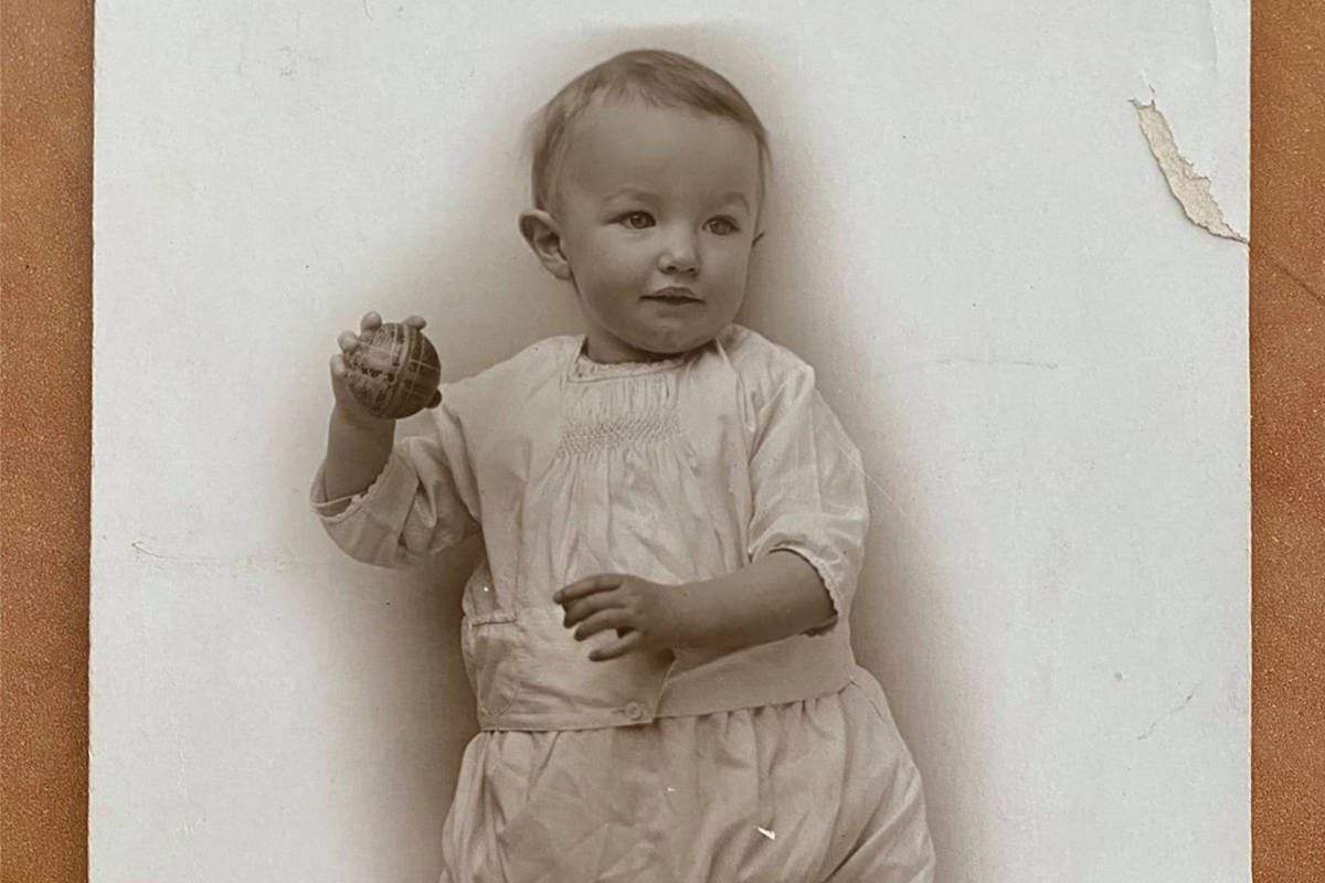 A 107-year-old baby photo was found in the pages of a book borrowed from the Vernon branch of the Okanagan Regional Library March 17, 2021. (Facebook photo)