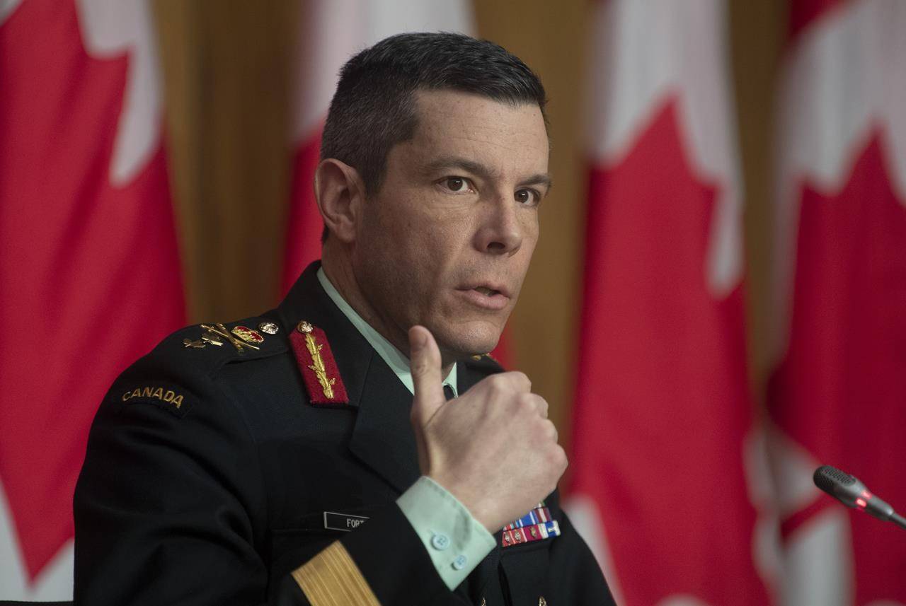 Major General Dany Fortin responds to a question on COVID vaccines during a news conference, Thursday, January 14, 2021 in Ottawa. THE CANADIAN PRESS/Adrian Wyld