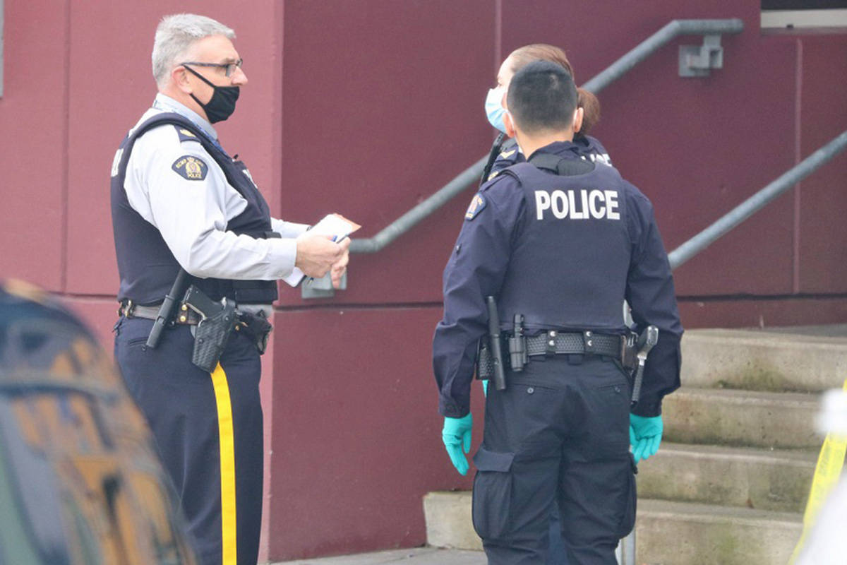 Surrey RCMP officers seen wearing masks during an incident in Surrey in March 2021. (Shane MacKichan photos)
