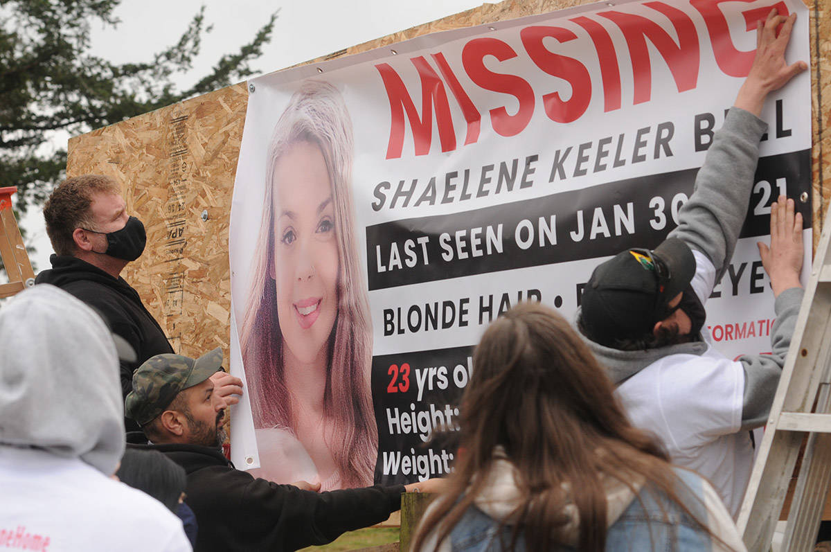 Friends and family members of Shaelene Keeler Bell help hang a banner along Highway 1 in Abbotsford near Bradner Road on Saturday, March 27, 2021. Bell of Chilliwack was last seen on Jan. 30, 2021. (Jenna Hauck/ Chilliwack Progress)